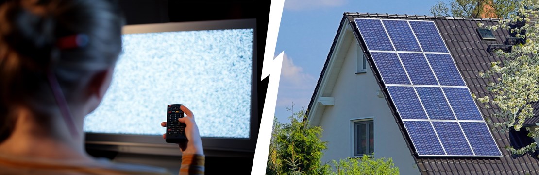 hustak med solceller samt en tv-skärm med störningar på