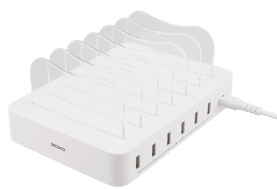Vit rektangulär USB-laddare med 6 portar. Genomskinliga plastdetaljer för sladdar på ovansidan.